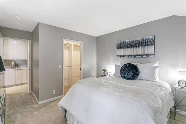 carpeted bedroom with vaulted ceiling