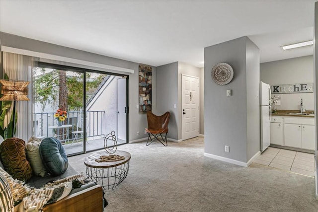 living room with sink and light carpet