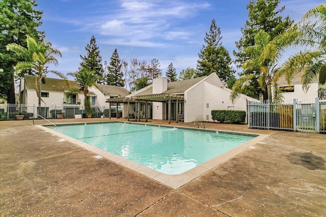 view of swimming pool with a patio area