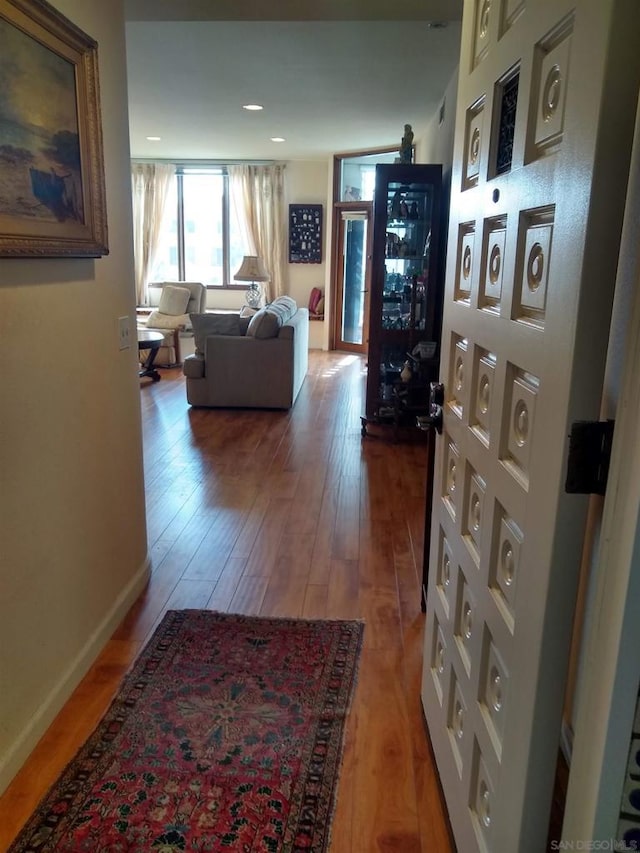 corridor featuring wood-type flooring