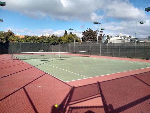 view of tennis court with basketball court