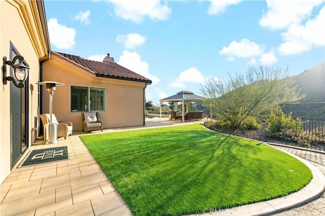 view of yard featuring a gazebo, a patio area, and fence