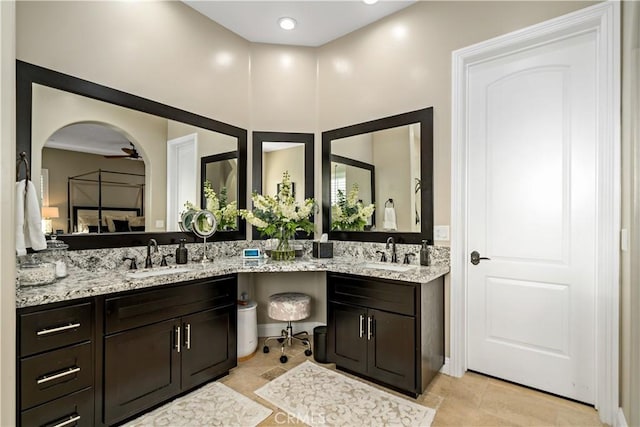 full bath with a sink and double vanity