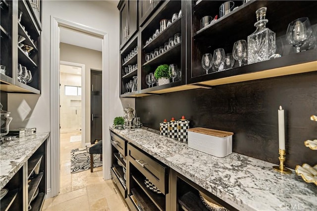 bar featuring stone tile floors