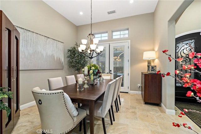 dining room with baseboards, visible vents, stone finish floor, a notable chandelier, and recessed lighting