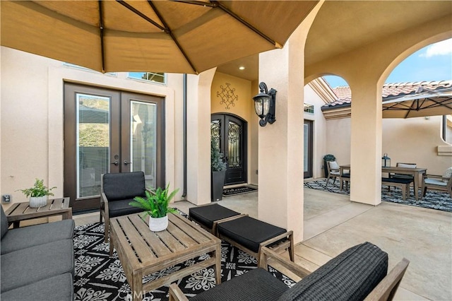 view of patio featuring outdoor dining space and french doors