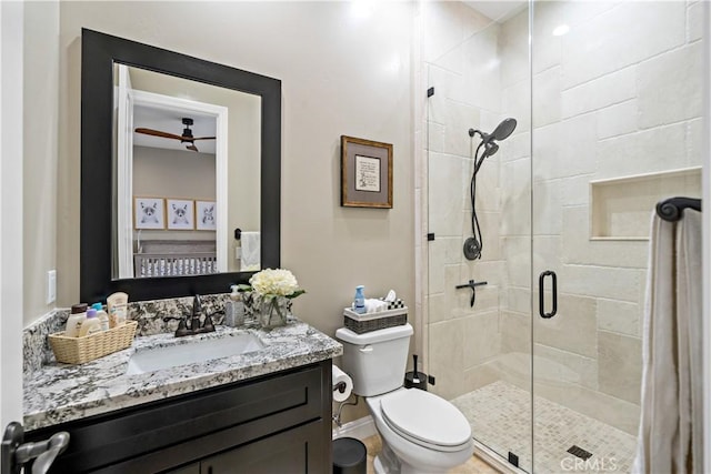 full bath with a shower stall, toilet, and vanity