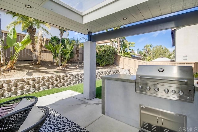 view of patio / terrace with area for grilling and a grill