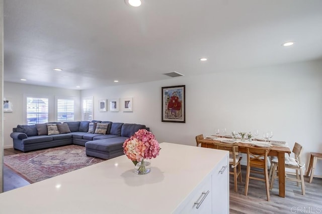 kitchen featuring white cabinetry and light hardwood / wood-style flooring