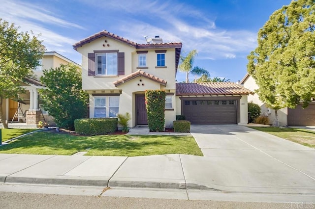 mediterranean / spanish-style home with a garage and a front yard