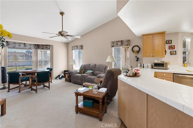 living room featuring lofted ceiling, light carpet, and ceiling fan