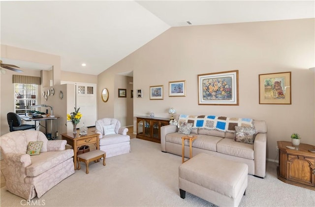 living room featuring lofted ceiling, light colored carpet, and ceiling fan