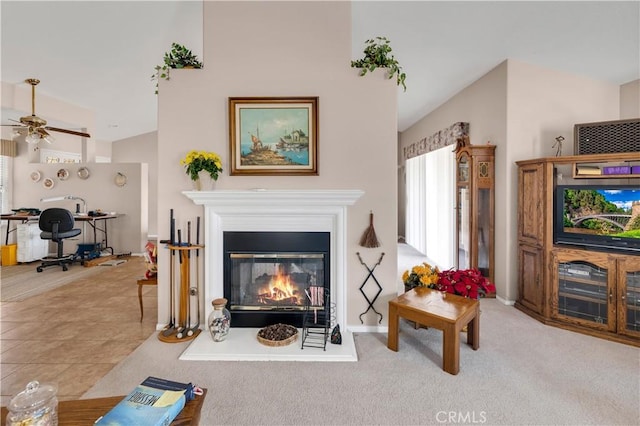 living room with light tile patterned floors, high vaulted ceiling, and ceiling fan