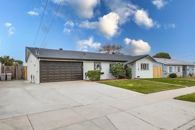 ranch-style house with a garage and a front yard