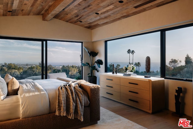 bedroom with multiple windows, light wood-type flooring, vaulted ceiling with beams, and wood ceiling