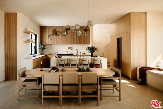 kitchen featuring tasteful backsplash and light hardwood / wood-style floors