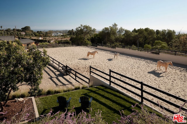 view of yard with a rural view