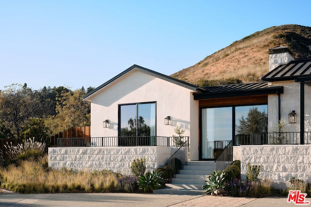 view of front of home with a mountain view