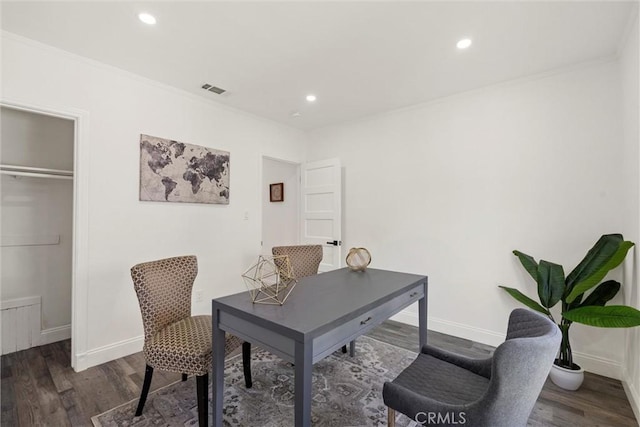 office area with crown molding and dark wood-type flooring