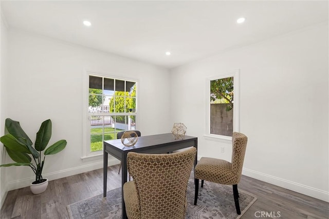 dining space with dark wood-type flooring