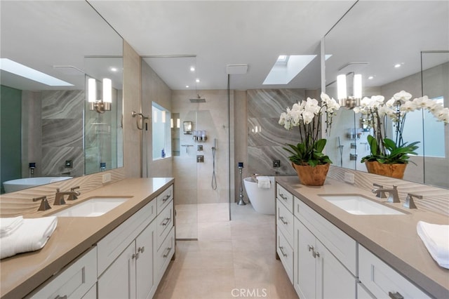 bathroom featuring tile walls, walk in shower, and a sink