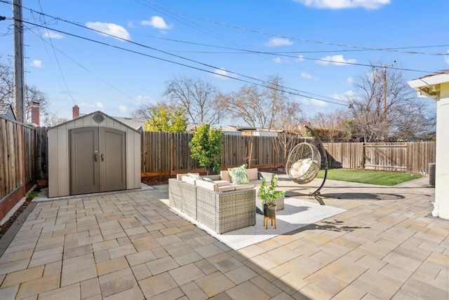 view of patio / terrace featuring a storage shed and an outdoor living space