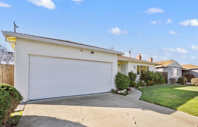 single story home with a garage and a front lawn