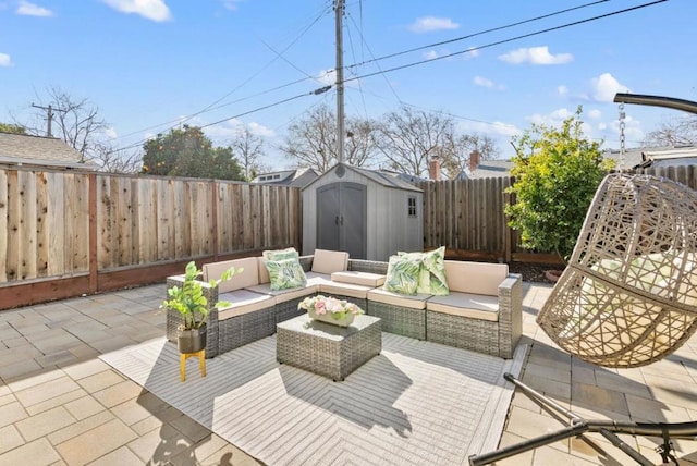 view of patio / terrace featuring an outdoor living space and a shed