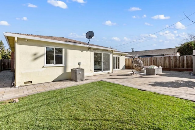 back of property featuring central AC, an outdoor living space, and a patio area