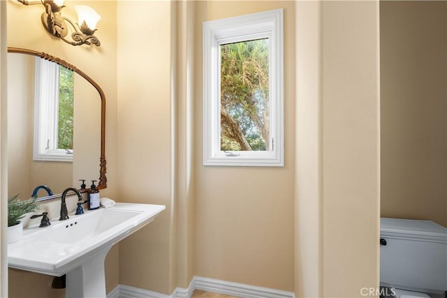 bathroom featuring sink and toilet