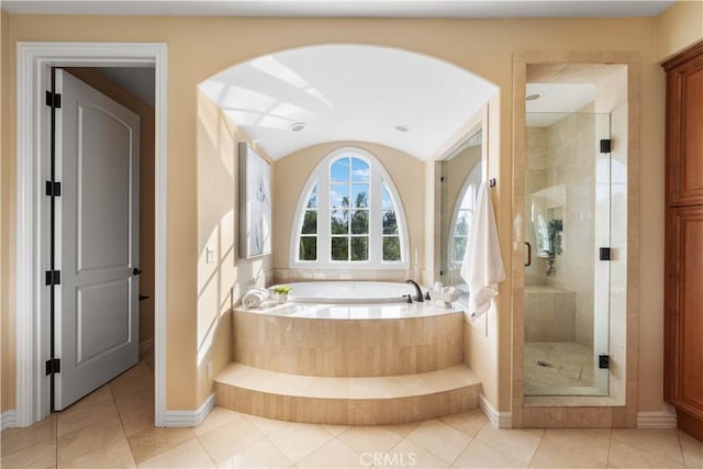 bathroom with plus walk in shower and tile patterned flooring