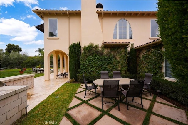 rear view of property with a patio