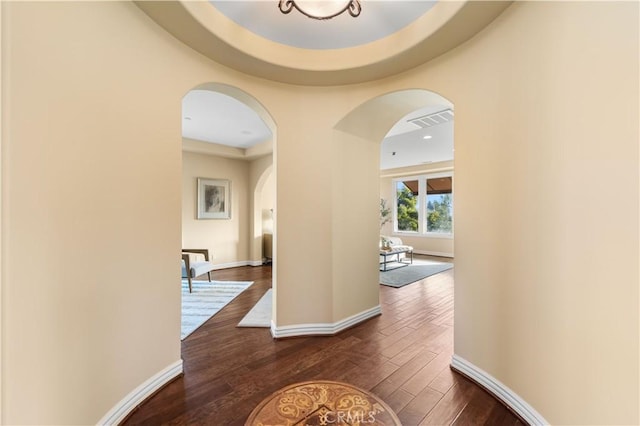 hall with dark wood-type flooring