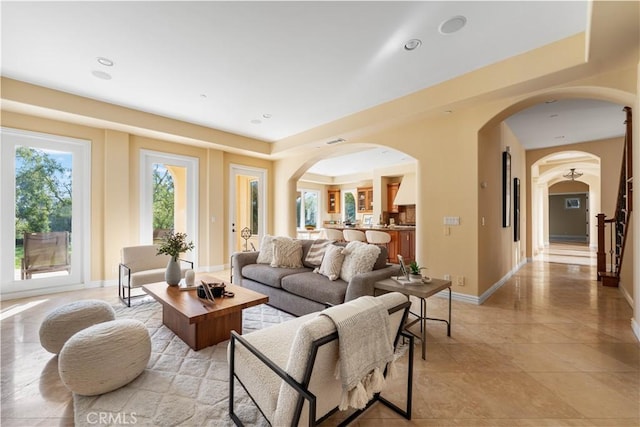 living room with a tray ceiling