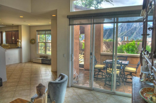 entryway with tile patterned floors and a mountain view