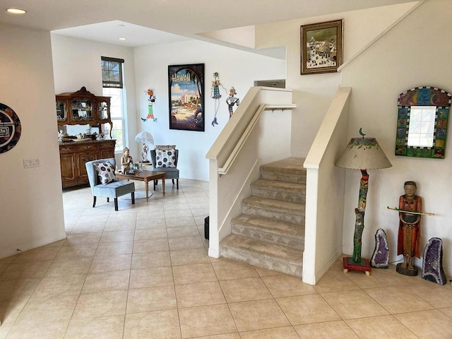 staircase with tile patterned floors