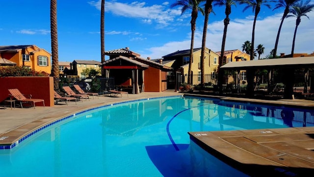 view of swimming pool with a patio