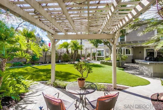 view of patio / terrace with a bar and a pergola