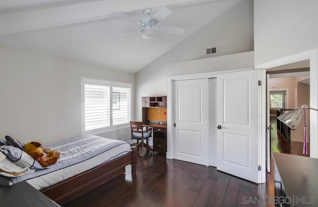 bedroom featuring ceiling fan, dark hardwood / wood-style flooring, high vaulted ceiling, and a closet