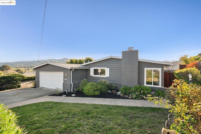 ranch-style house with a garage and a front yard