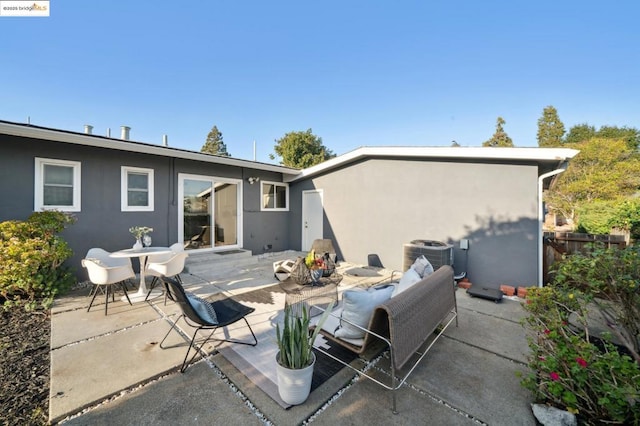 rear view of house featuring a patio area and central air condition unit