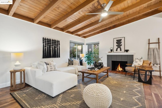 living room featuring vaulted ceiling with beams, hardwood / wood-style flooring, wooden ceiling, and a brick fireplace