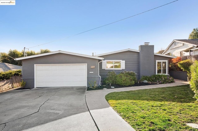 ranch-style house featuring a garage and a front yard