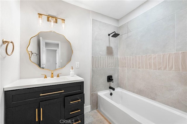 bathroom with vanity and tiled shower / bath combo