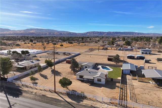 birds eye view of property with a mountain view