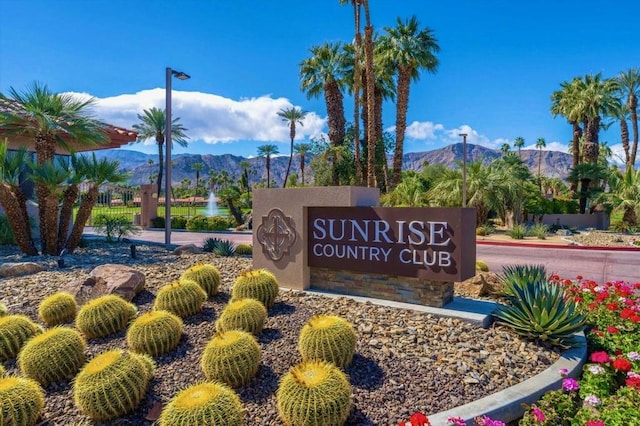 community sign featuring a mountain view