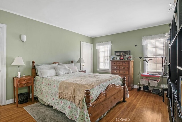 bedroom with wood-type flooring