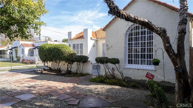 view of side of property featuring a patio