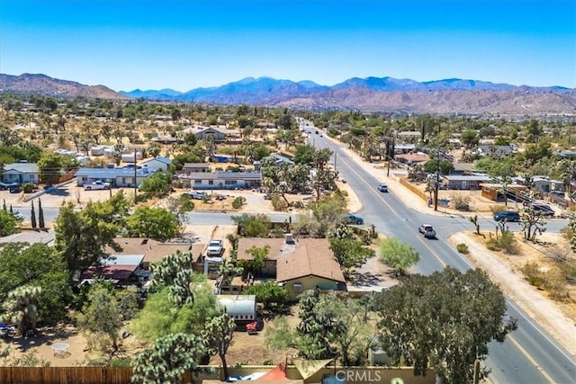 birds eye view of property featuring a mountain view