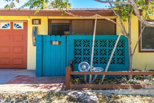 view of gate featuring a garage